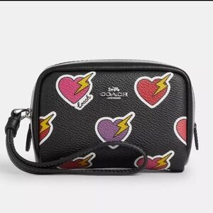 NWT Coach Pouch Wristlet With Heart Bolt Print